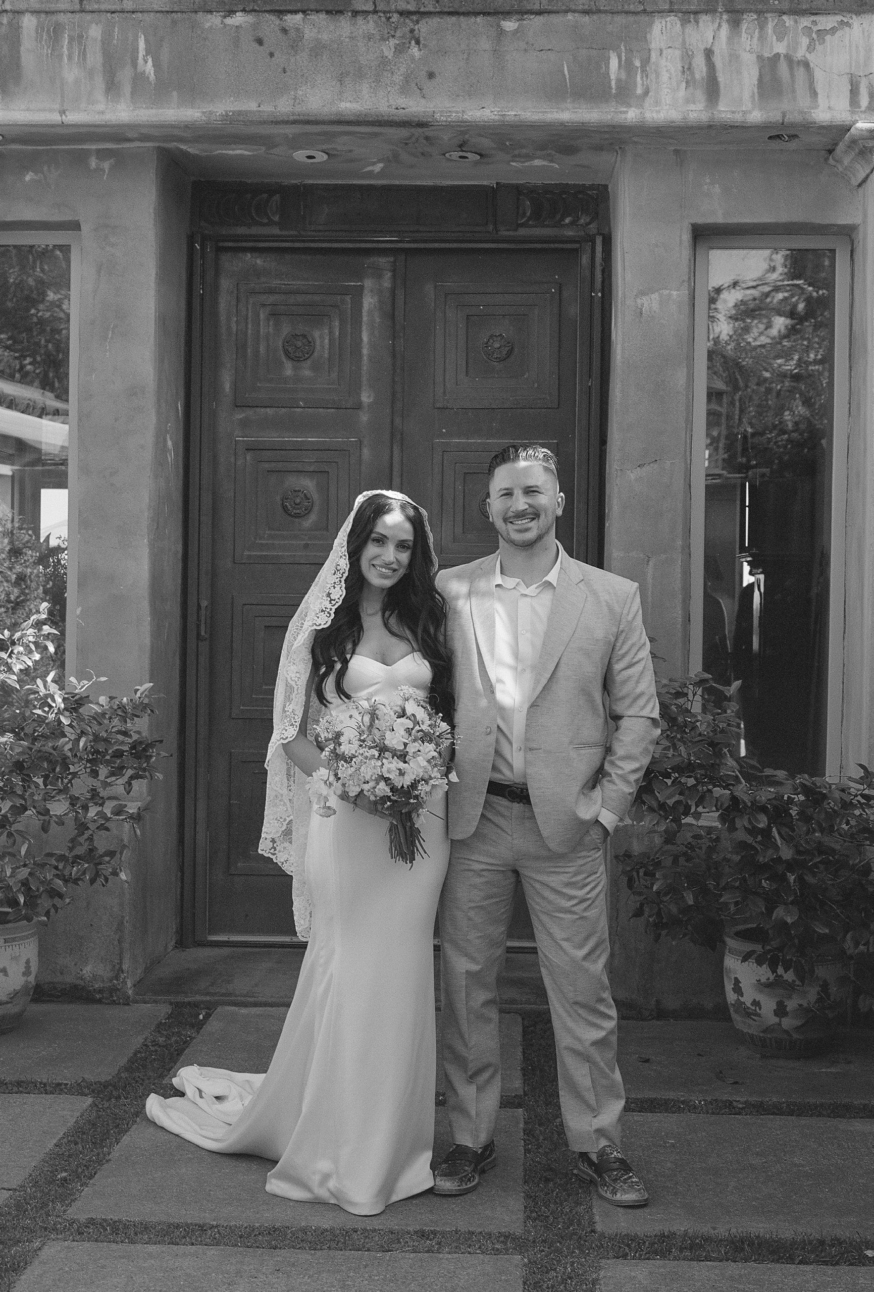 simple sheath sweetheart dress with knee length mantilla bridal veil with lace trim