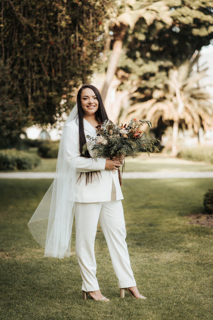 santa barbara bride wearing mid length ivory wedding veil with crystals and beads