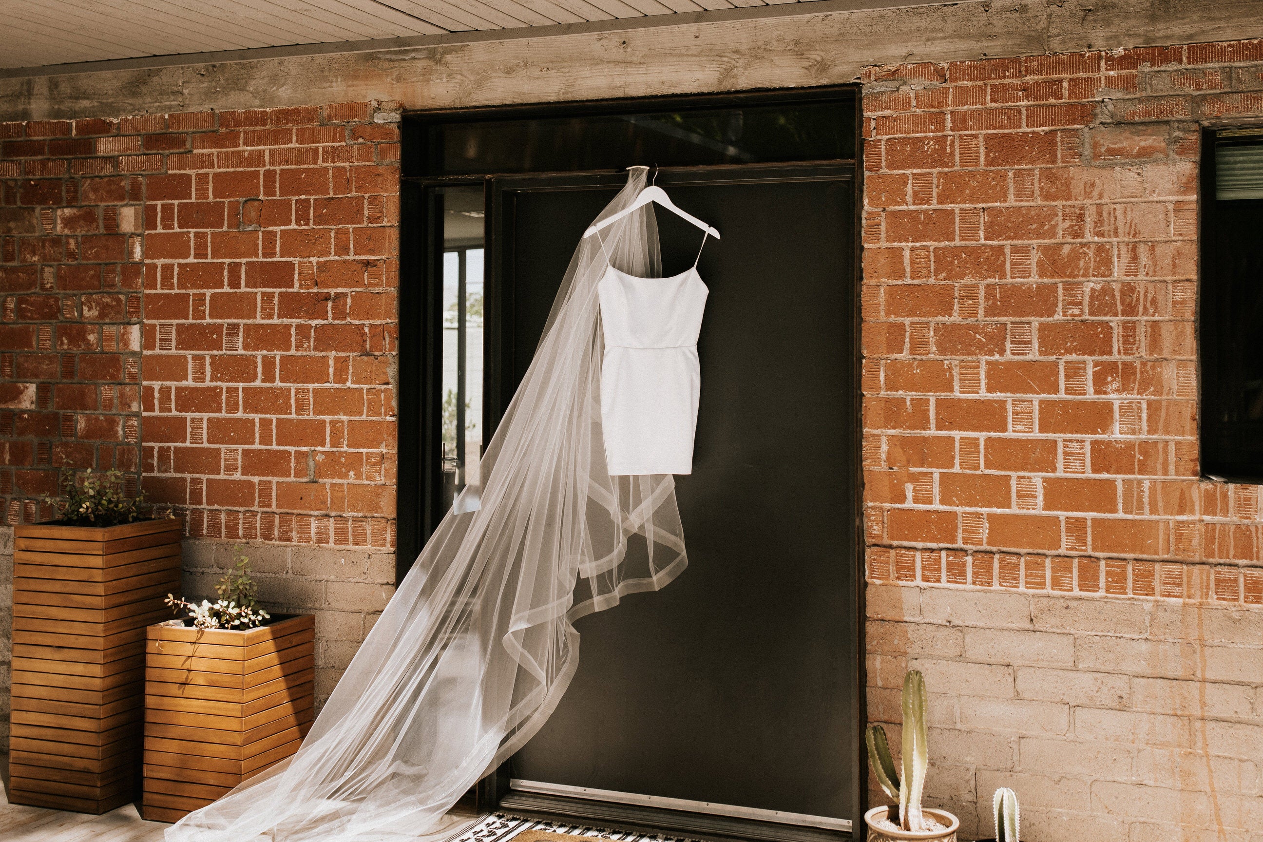 Load video: brides wearing a long drop cathedral wedding veil with blusher