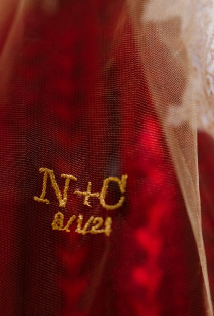 small gold initials with wedding date embroidered on wedding cape tulle