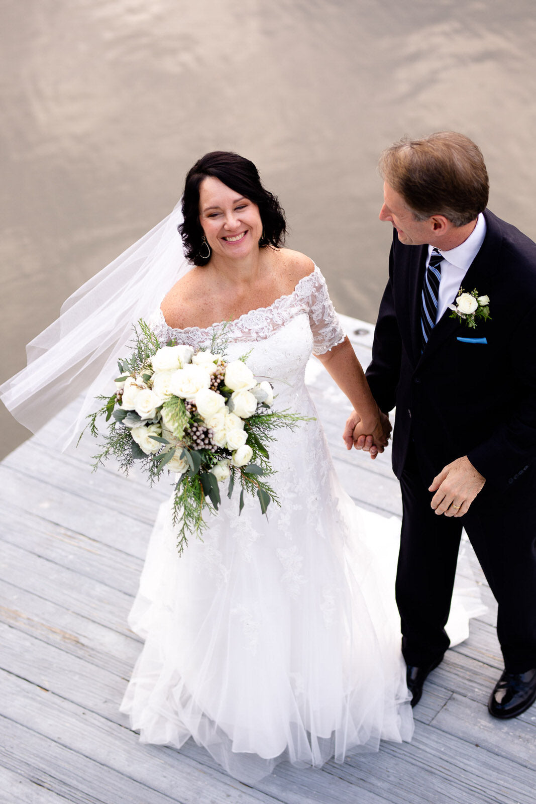 ocean pier wedding with lace off shoulder dress and simple short veil