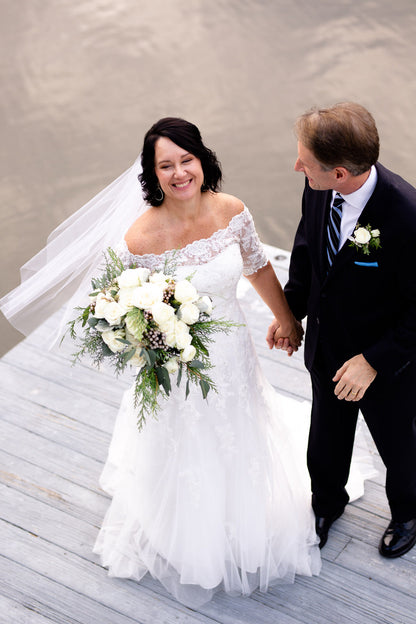 ocean pier wedding with lace off shoulder dress and simple short veil