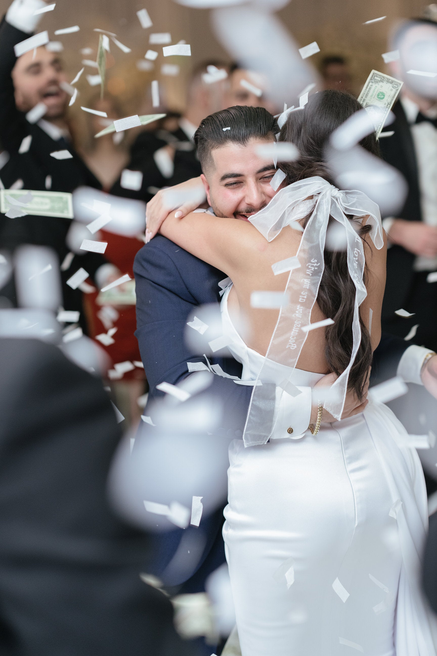 romantic reception look with bride in custom embroidered bridal bow