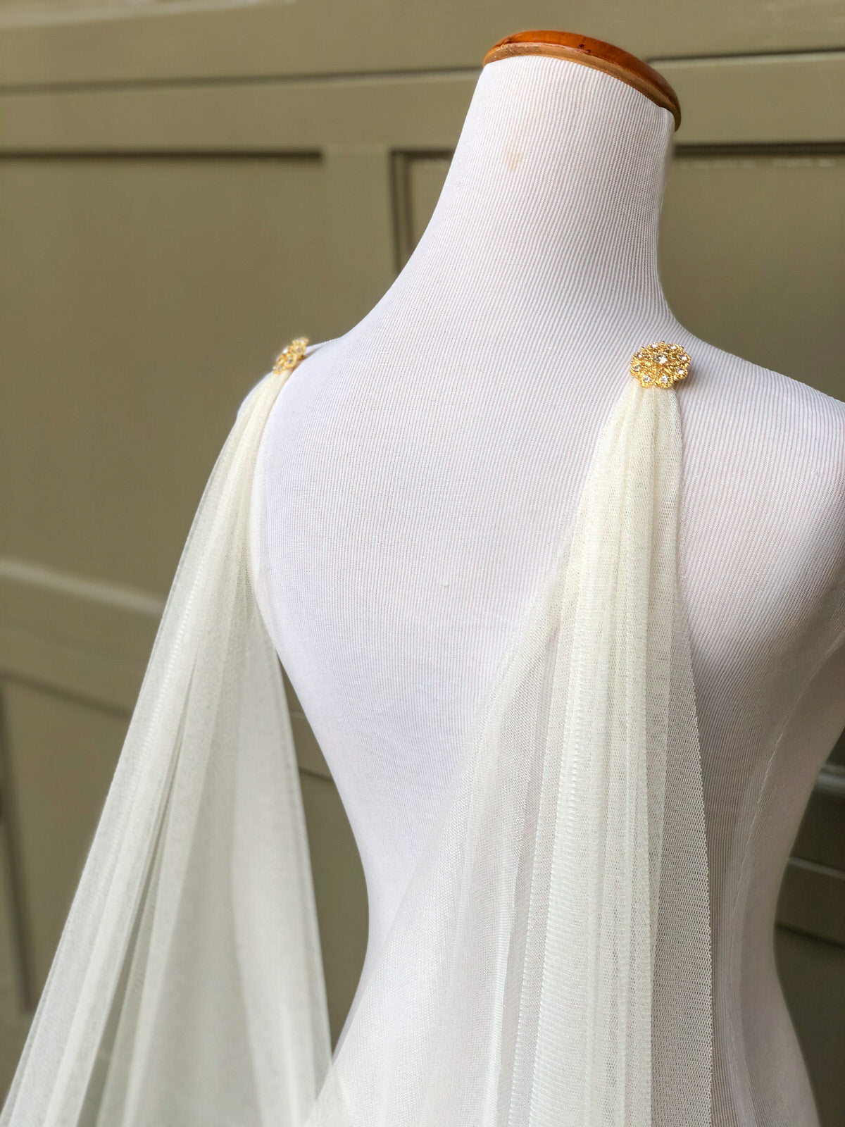 ivory wedding cape in English net with gold rhinestone brooches