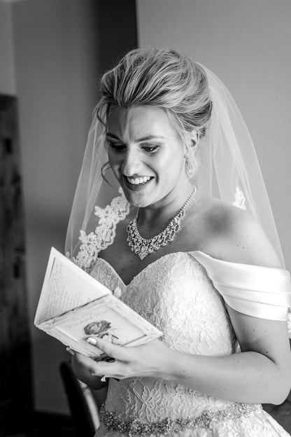 classic bride reading note wearing flower lace elbow length veil