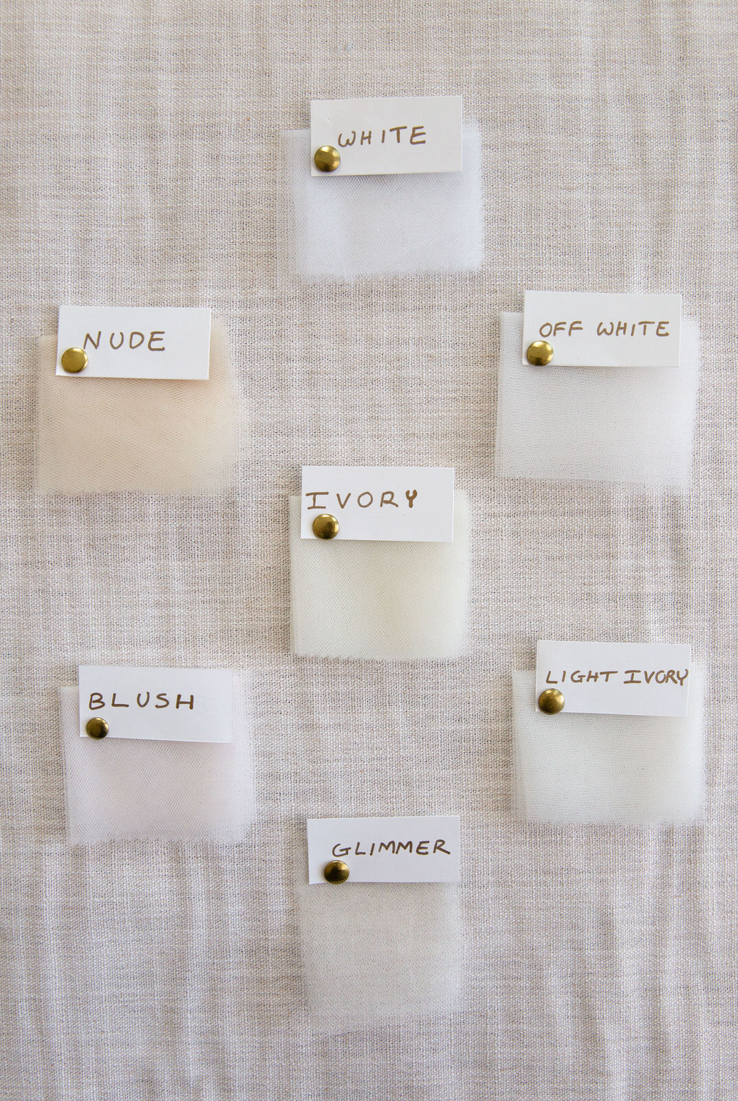 white off white and Ivory color swatches of fabric