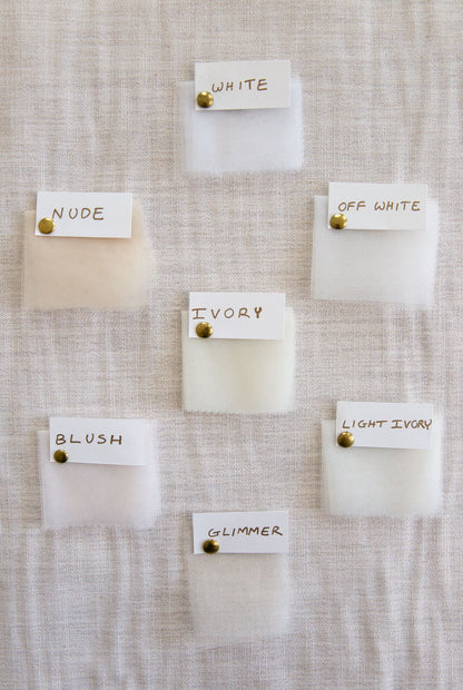 white off white and Ivory color swatches of fabric