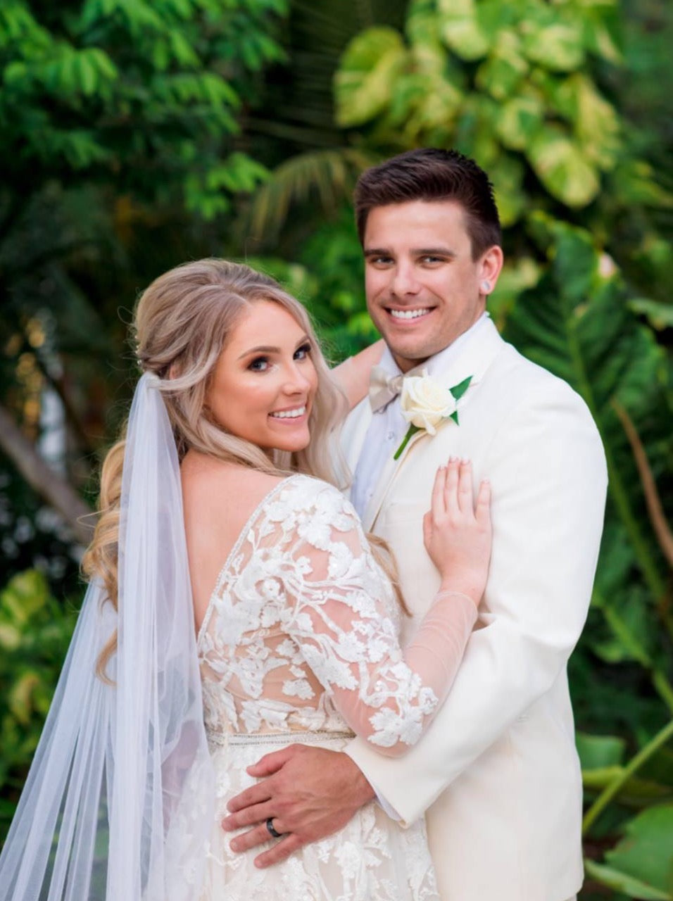romantic draped veil in bride's hair on the beach