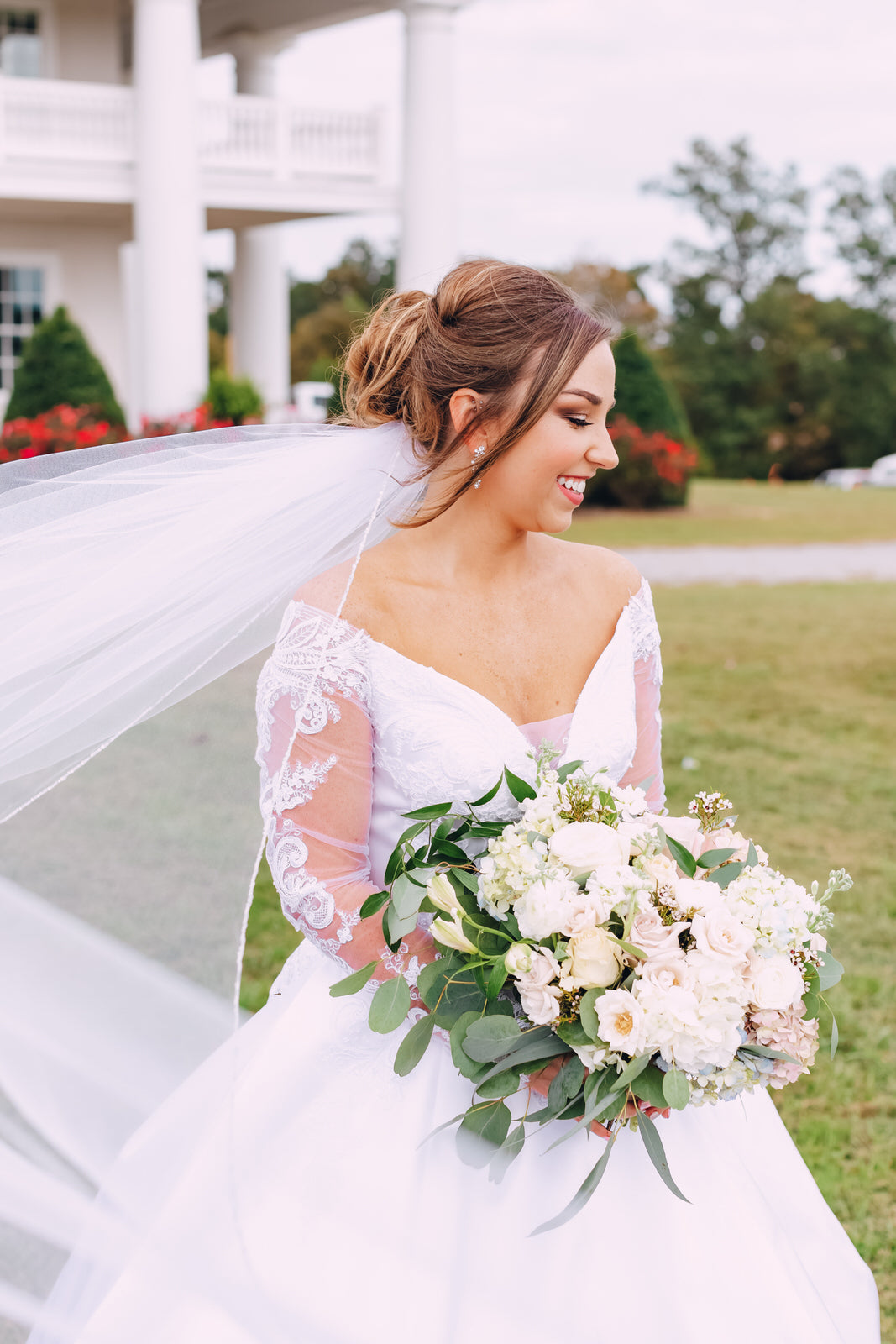beaded edged wedding veil underneath elegant updo