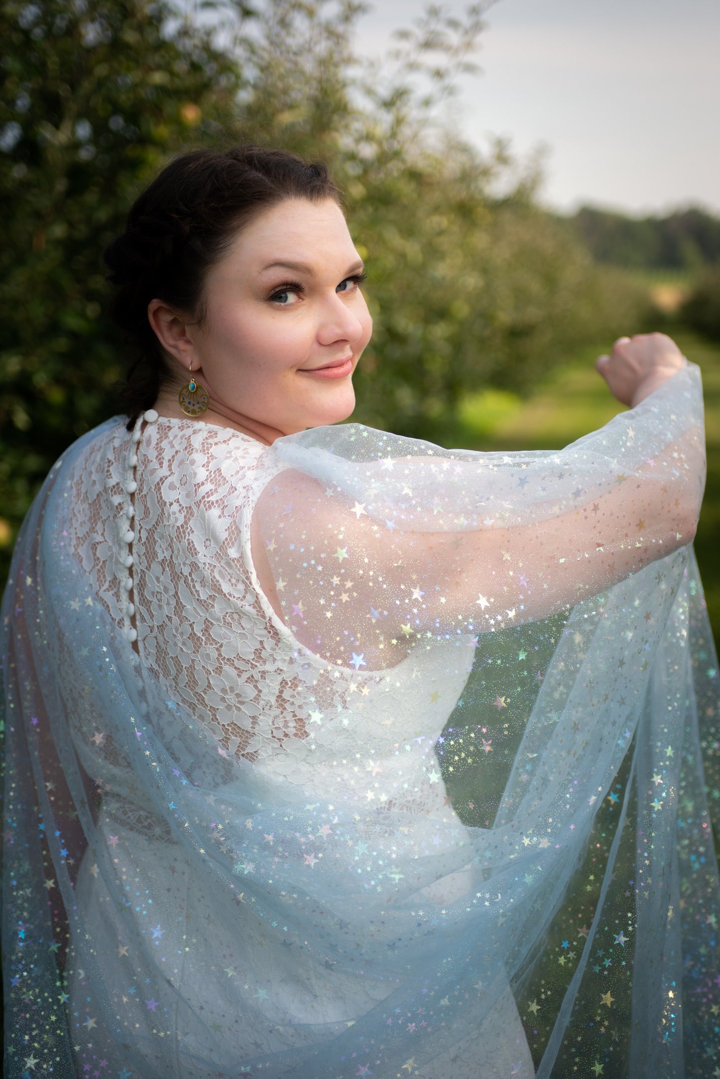 light blue star and moon draped wedding cape