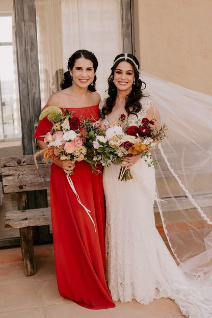 bohemian crystal hairpiece on bride with long cathedral scallop edge veil and bridesmaid in off shoulder red peasant gown
