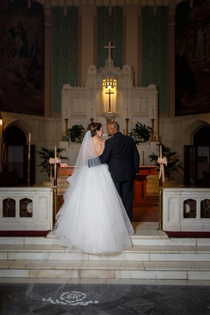 catholic church traditional wedding with cathedral veil with monogram