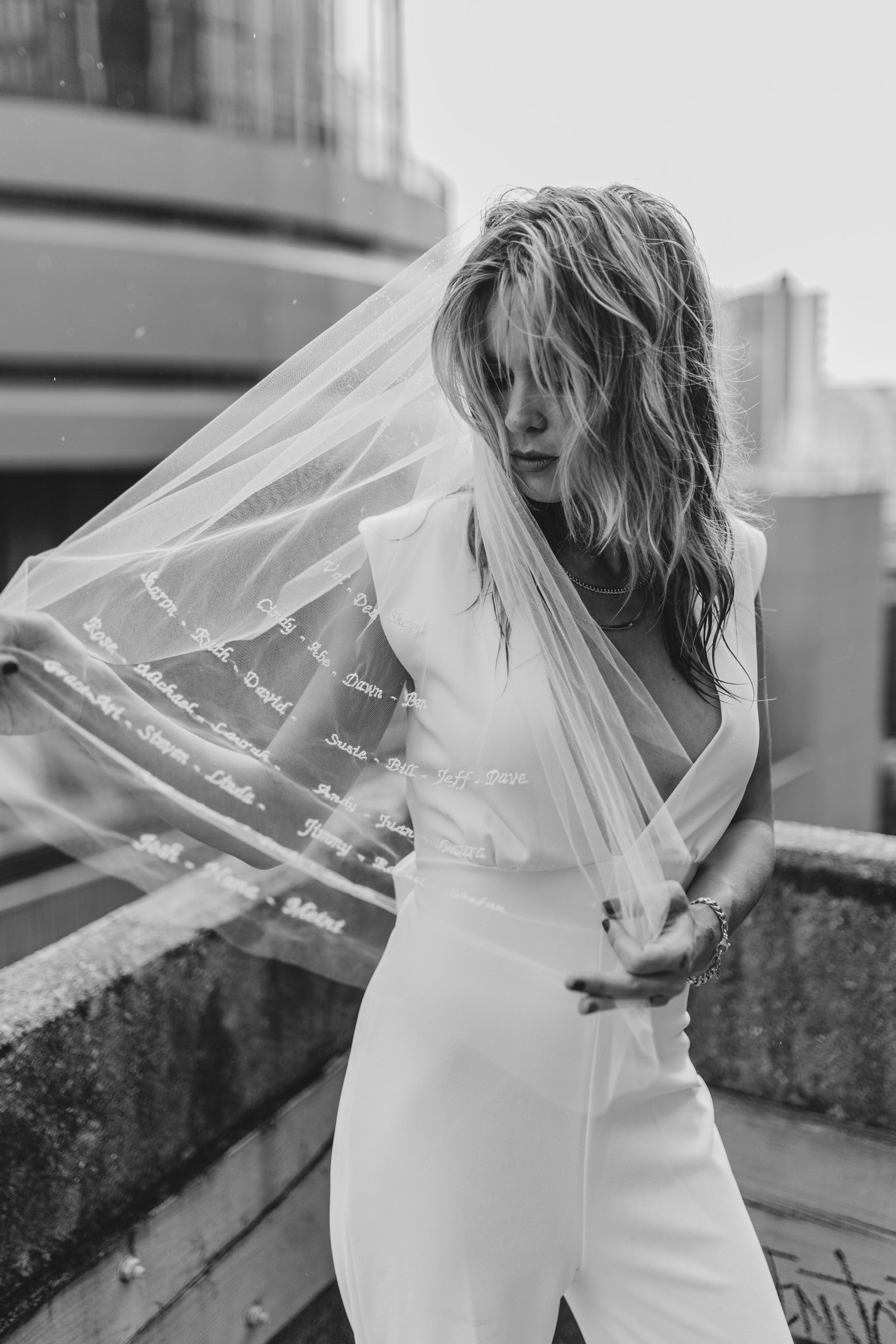 simple wedding veil with embroidered text fingertip lengthened bride in V neck jumpsuit