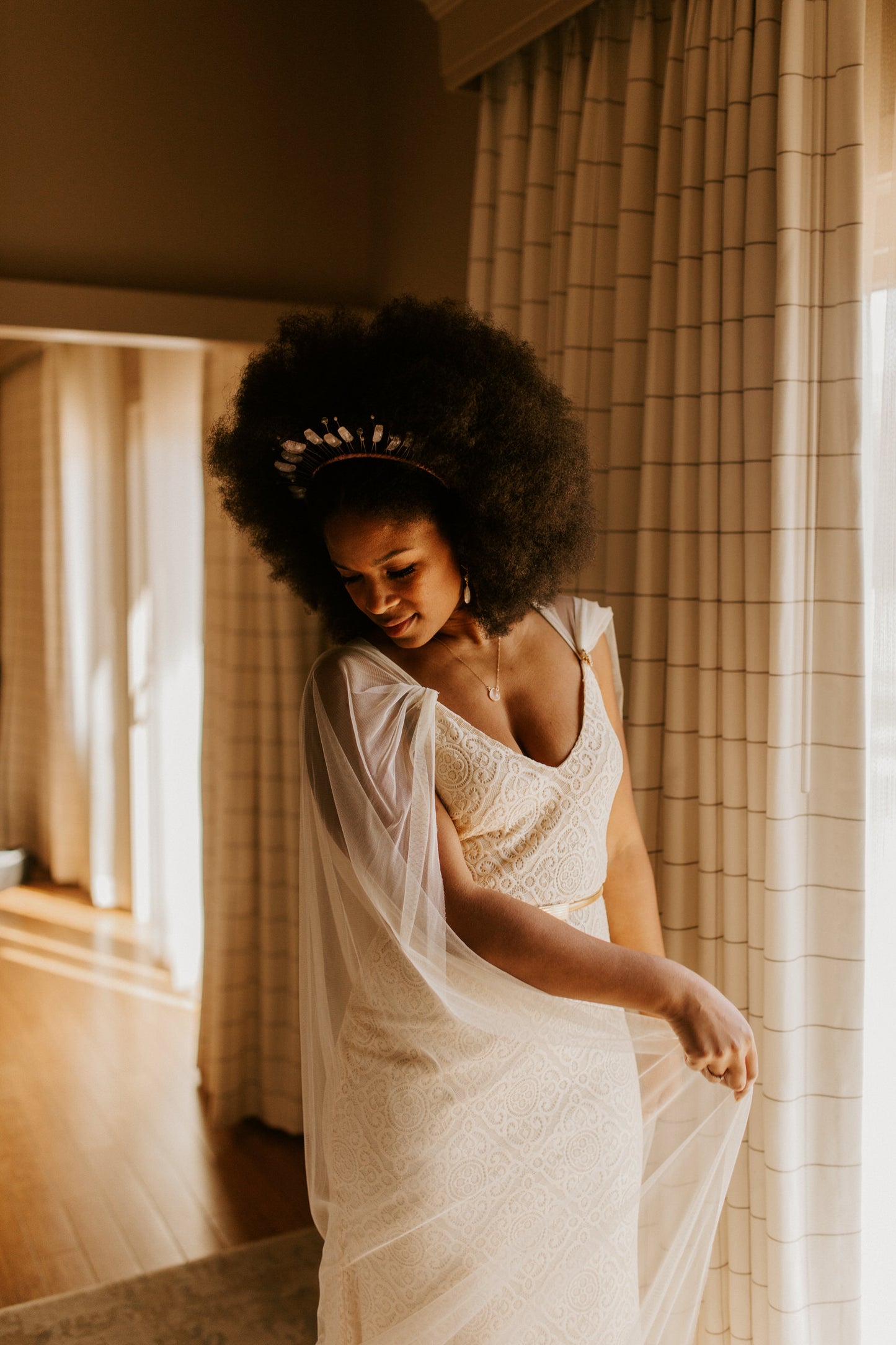 modern vegan bride wearing crown and soft silk bridal cloak