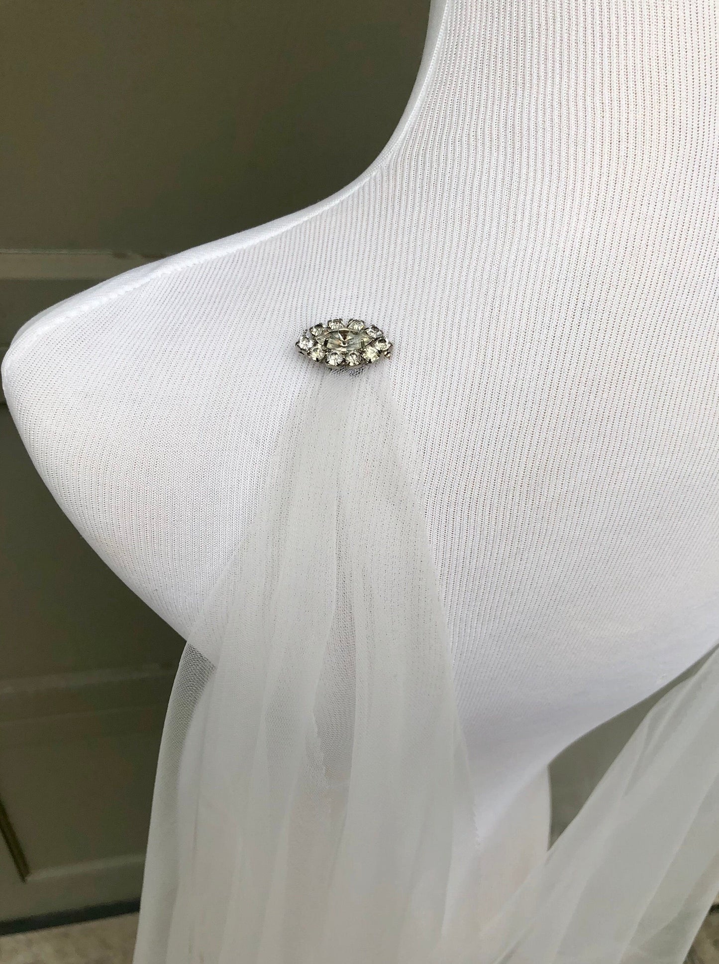 simple draped cape wrap tutorial with rhinestone pins for brides getting married
