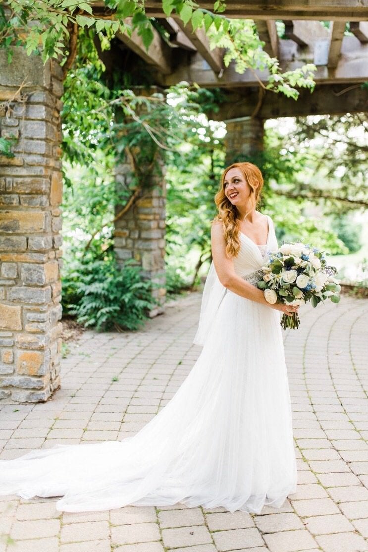 garden wedding with downdo hair and whimsical soft veil