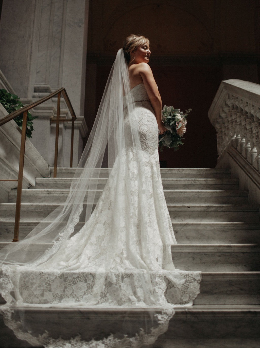 lace edged wedding veil cathedral length on staircase