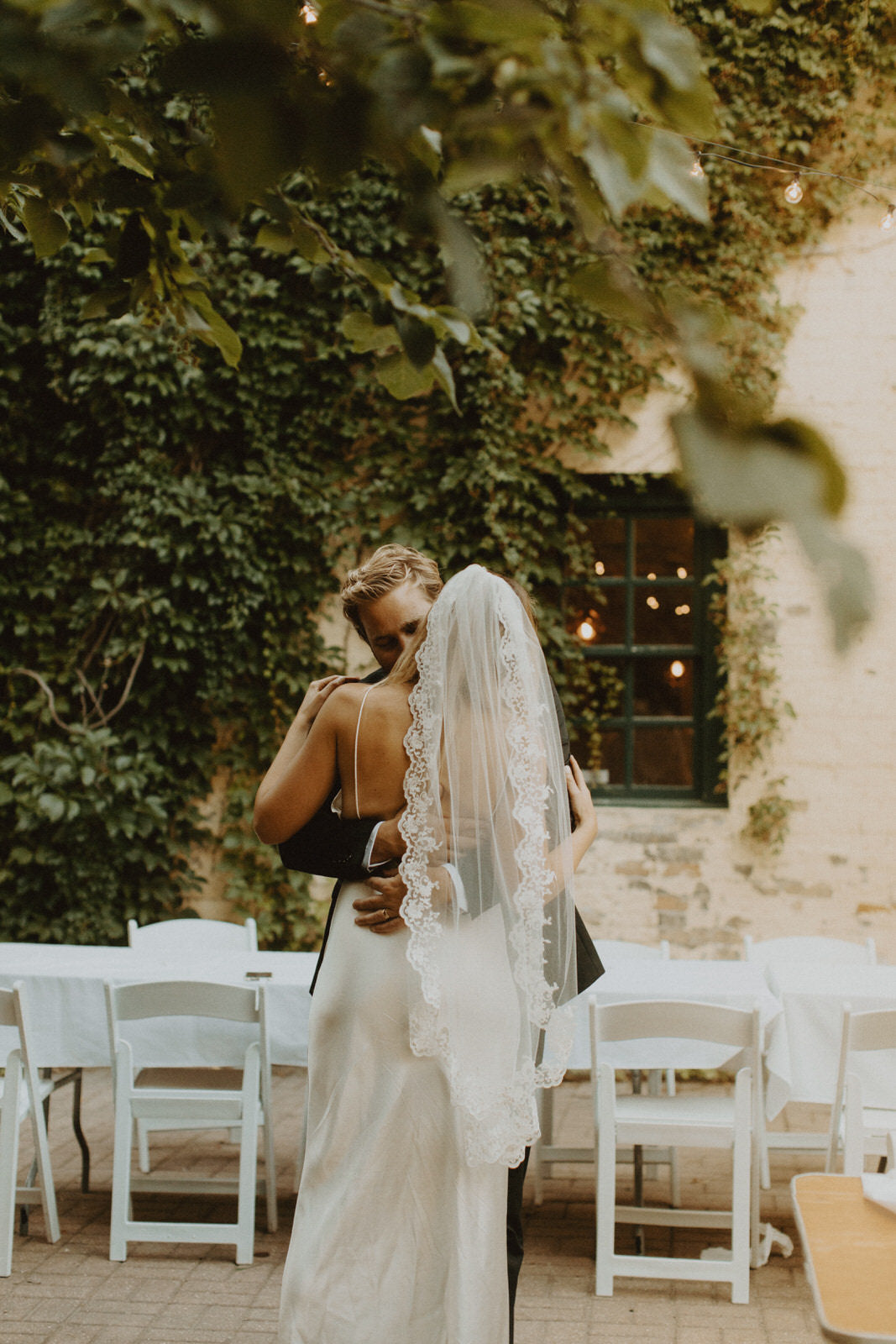 couple dancing and Bride wearing mantilla lace veil