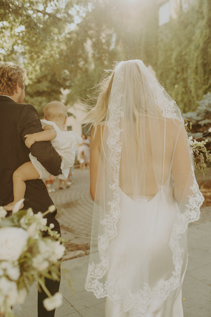full lace edged fingertip bridal veil for sunset wedding