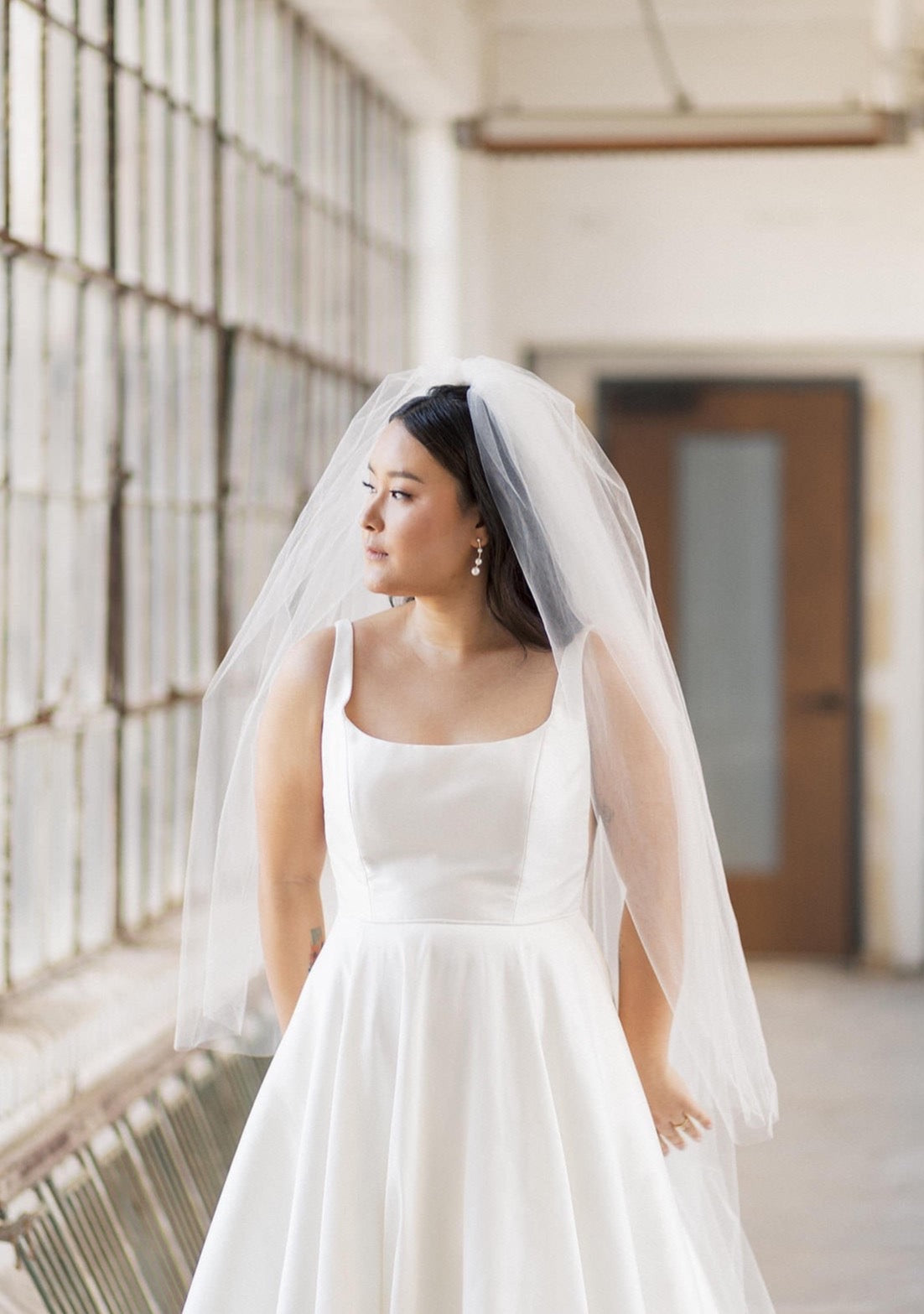 scoop neckline gown with two tier cathedral length blusher bridal veil