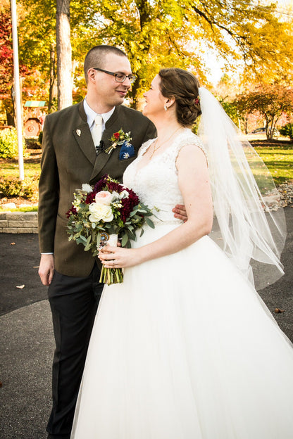 fall wedding with bride wearing crystal wedding veil over updo