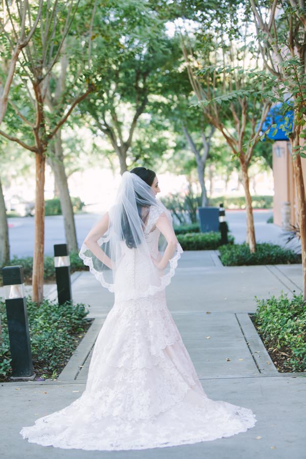 A line gown with fingertip length wedding veil