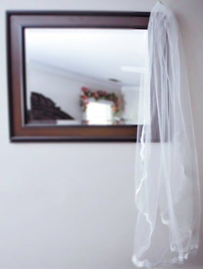 thin scallop lace veil over mirror