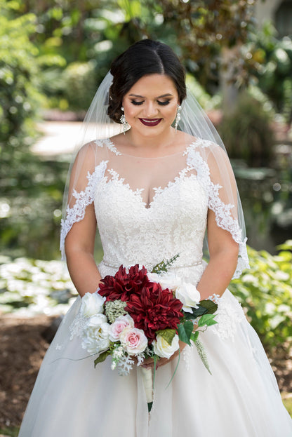 burgundy wedding with bride in sweetheart dress and short lace veil