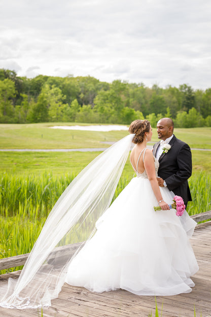 long raw edge wedding veil with soft ballgown dress for outdoor wedding