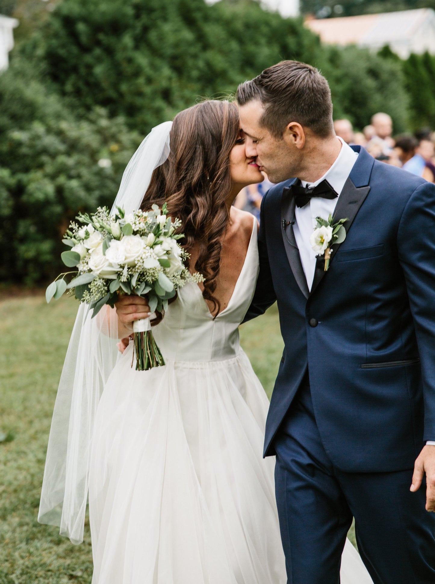 Minimalist Bridal Style with White Bouquet and Simple Veil with Hair Down