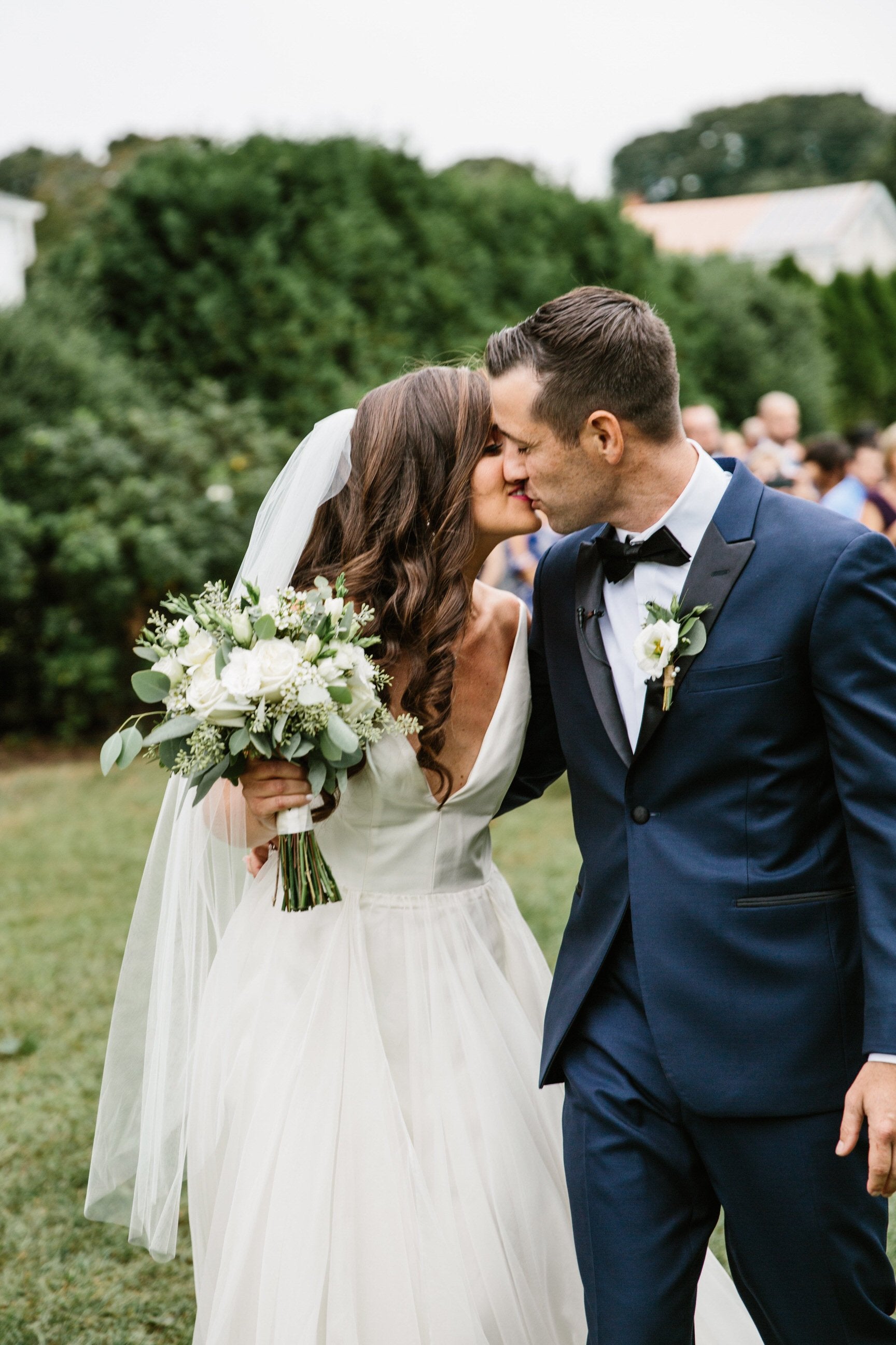 simple raw edge mid length veil on bride with hair down