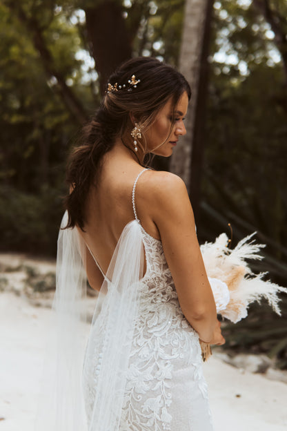tropical beach wedding with tulle wedding wings on spaghetti strap dress