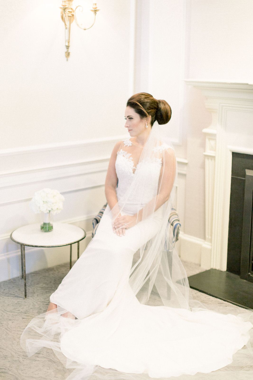 oversized updo bun and long simple English net bridal veil for lace dress