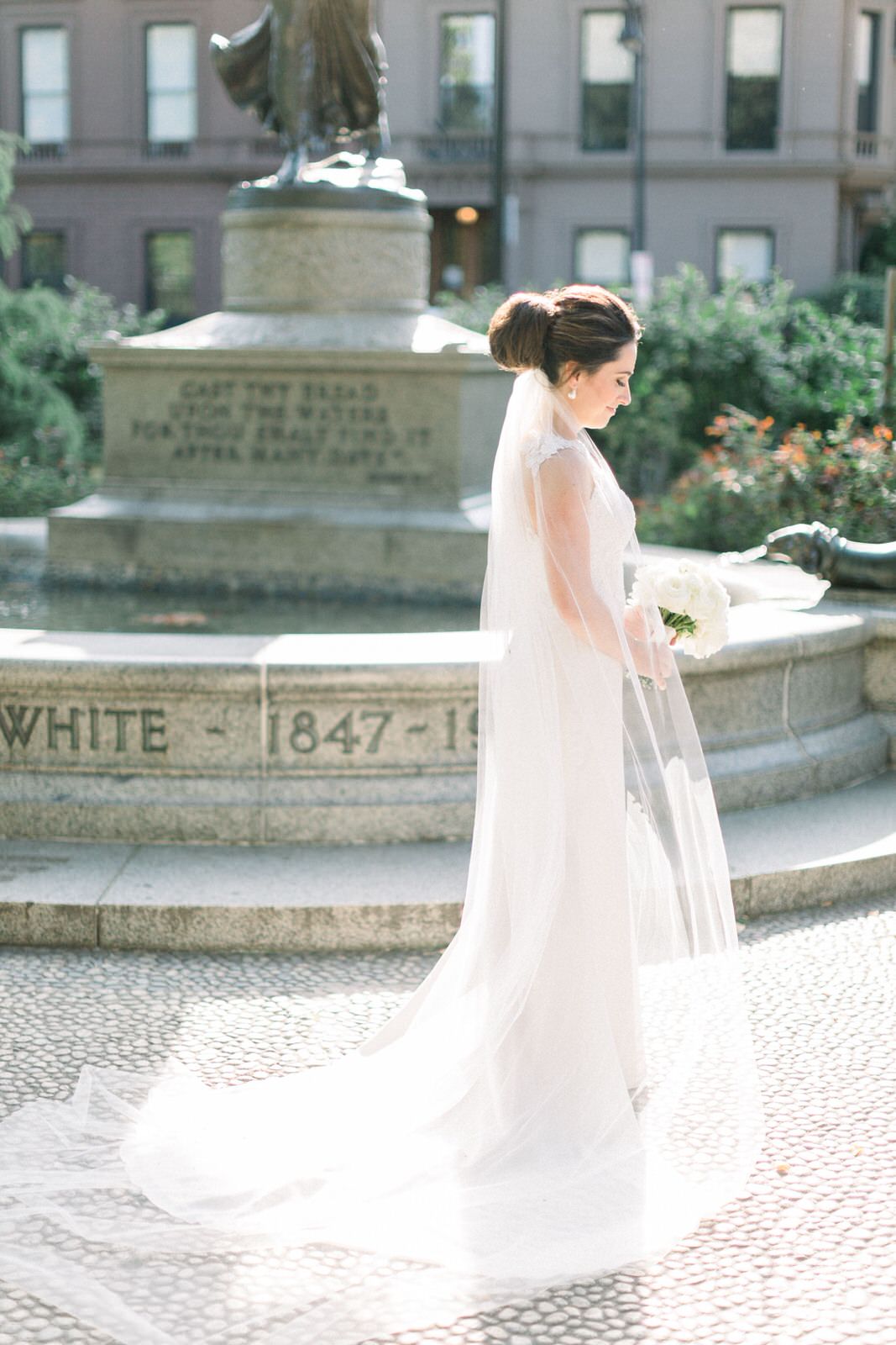 120 inch royal length wedding veil in silk under large bun updo on bride