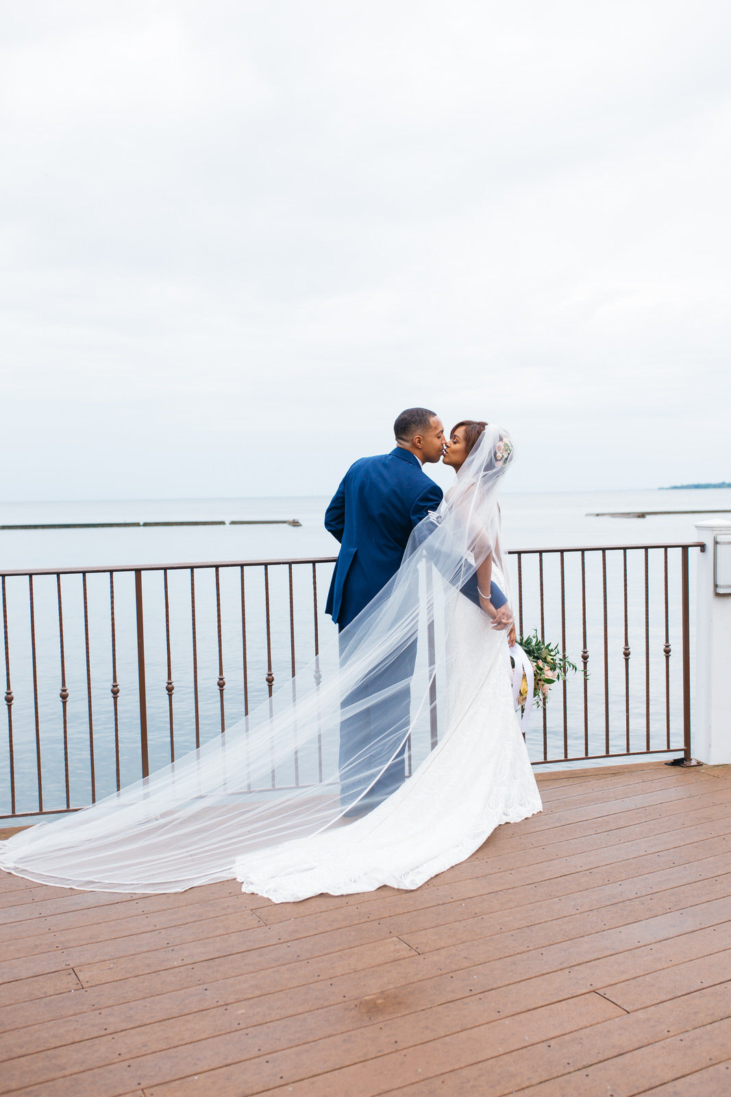 military wedding with bride in sheath dress and long cathedral veil