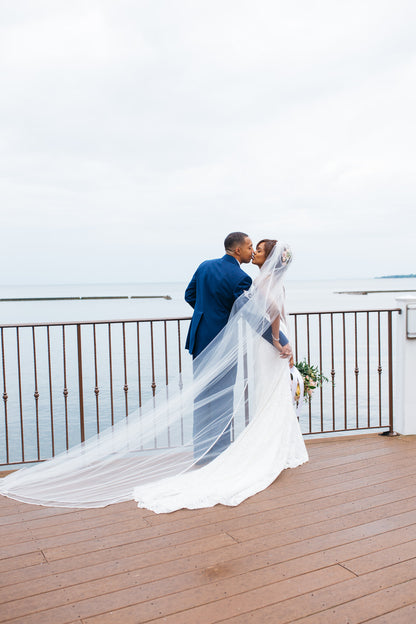 military wedding with bride in sheath dress and long cathedral veil