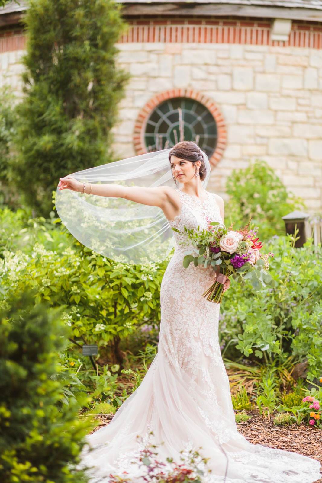 simple fingertip length wedding veil over low updo chignon