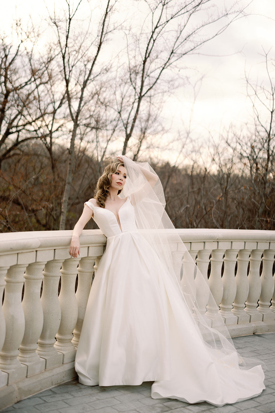 mansion wedding with deep v gown and long cathedral length pearl wedding veil with pearl