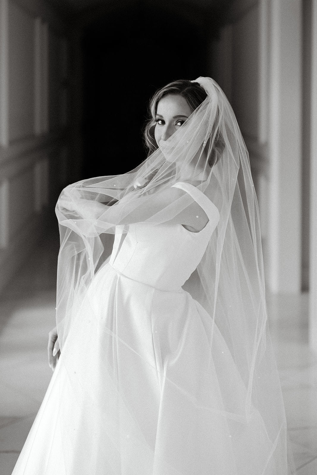 estate black tie wedding day with long bridal veil in downdo hairstyle