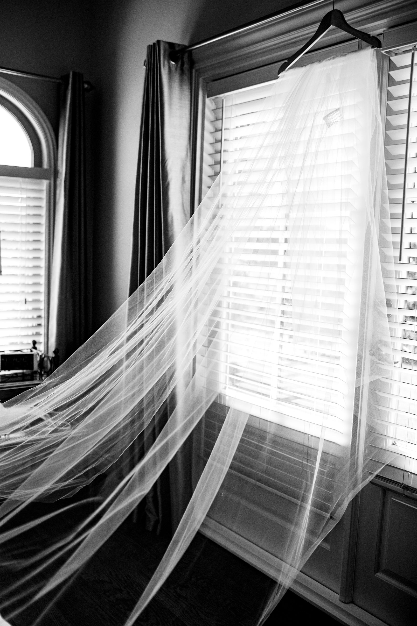 long veil folded over hanger to keep it wrinkle free on wedding day
