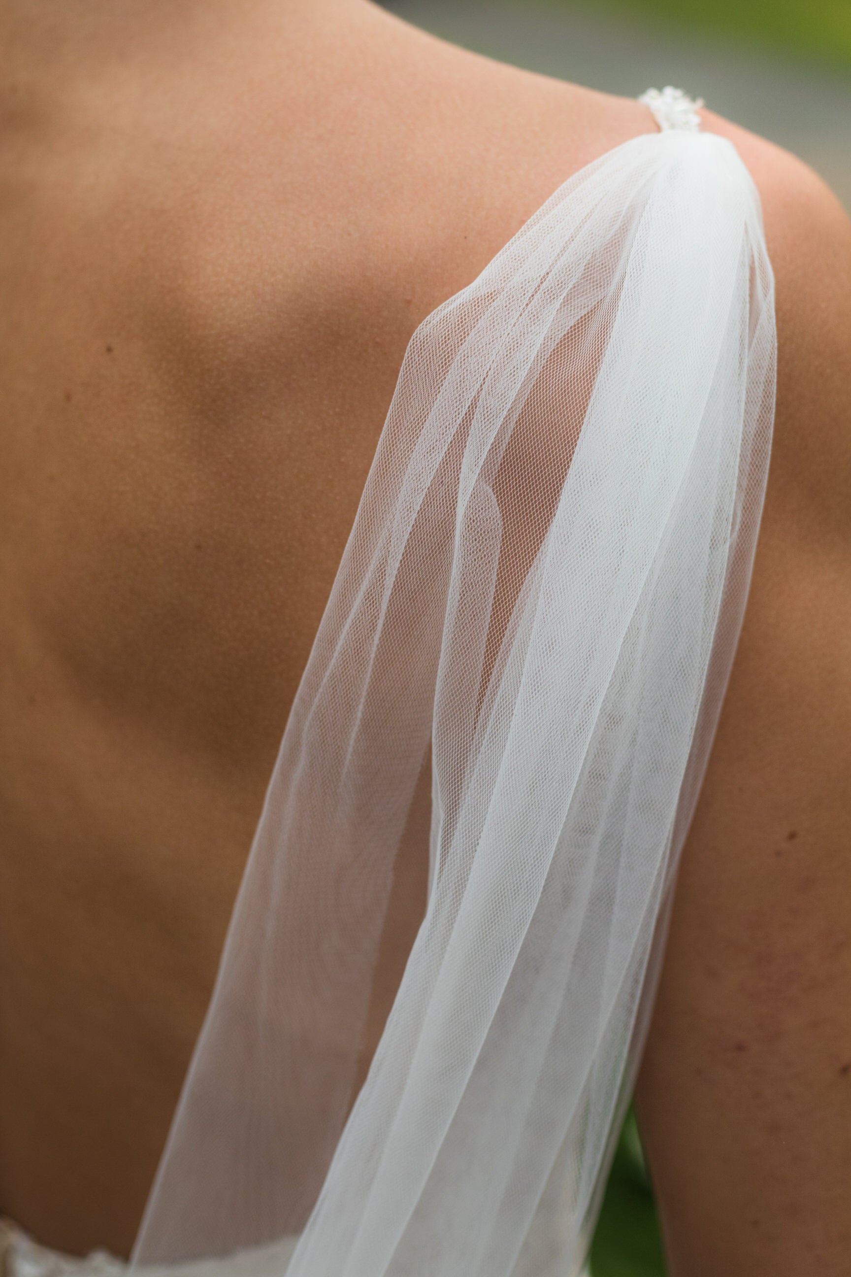 soft silk bridal wing set attached to thin spaghetti strap dress