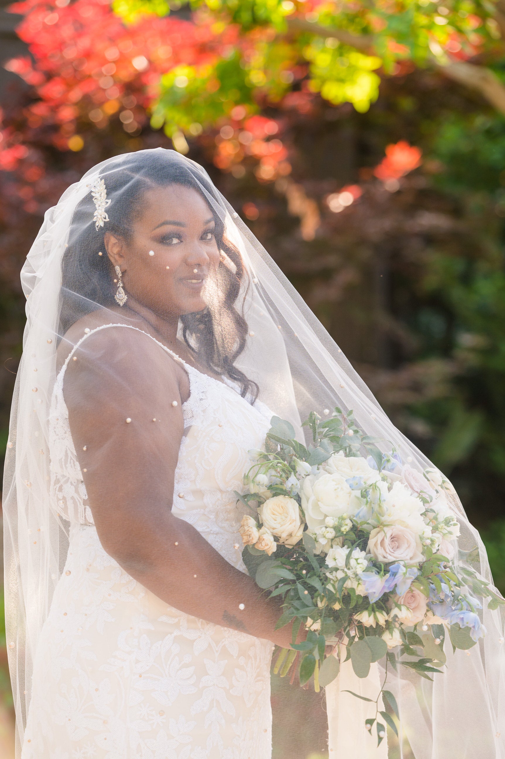 beaded pearl blusher veil over white and blue bouquet