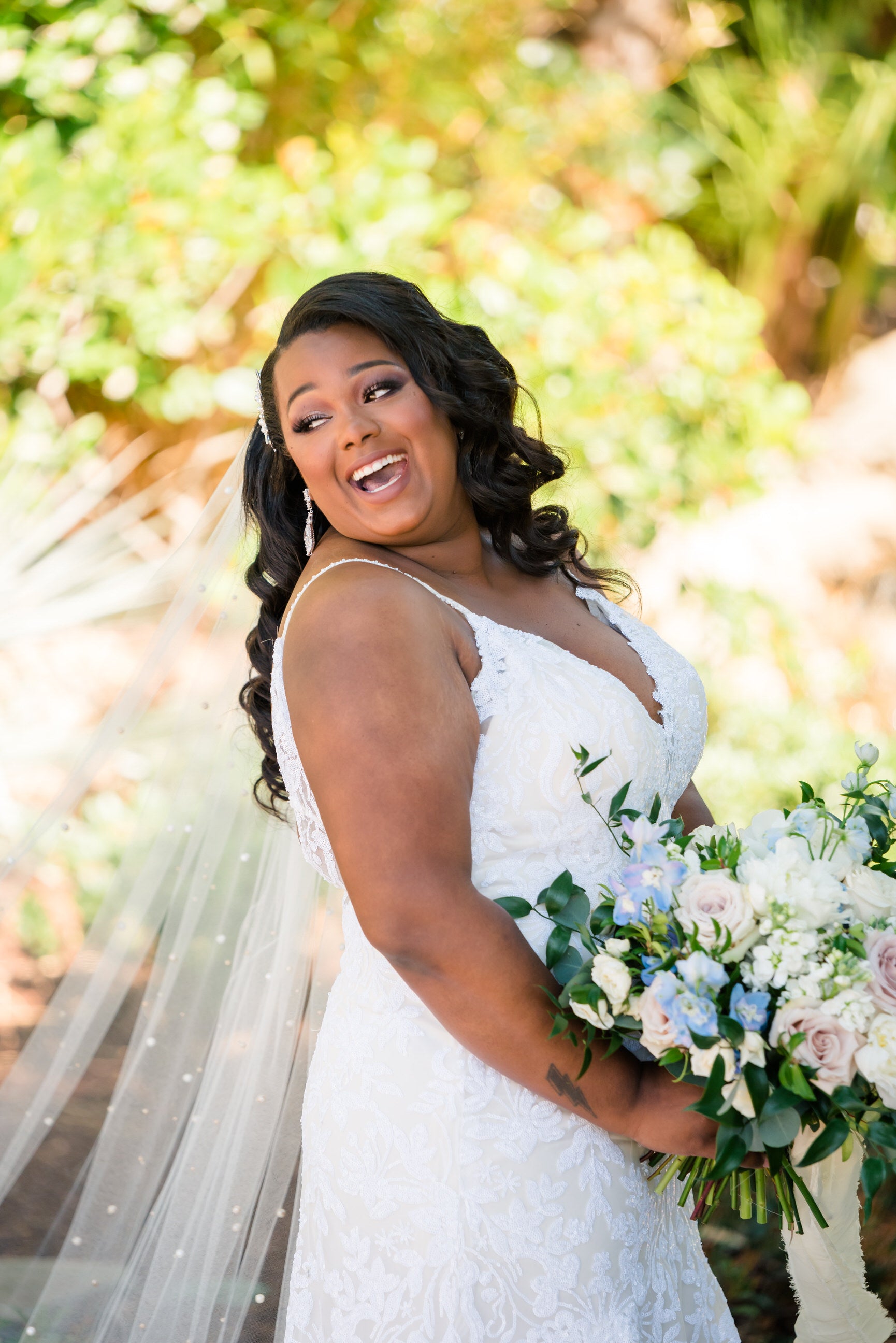long beaded pearl cathedral length wedding veil in curled downdo