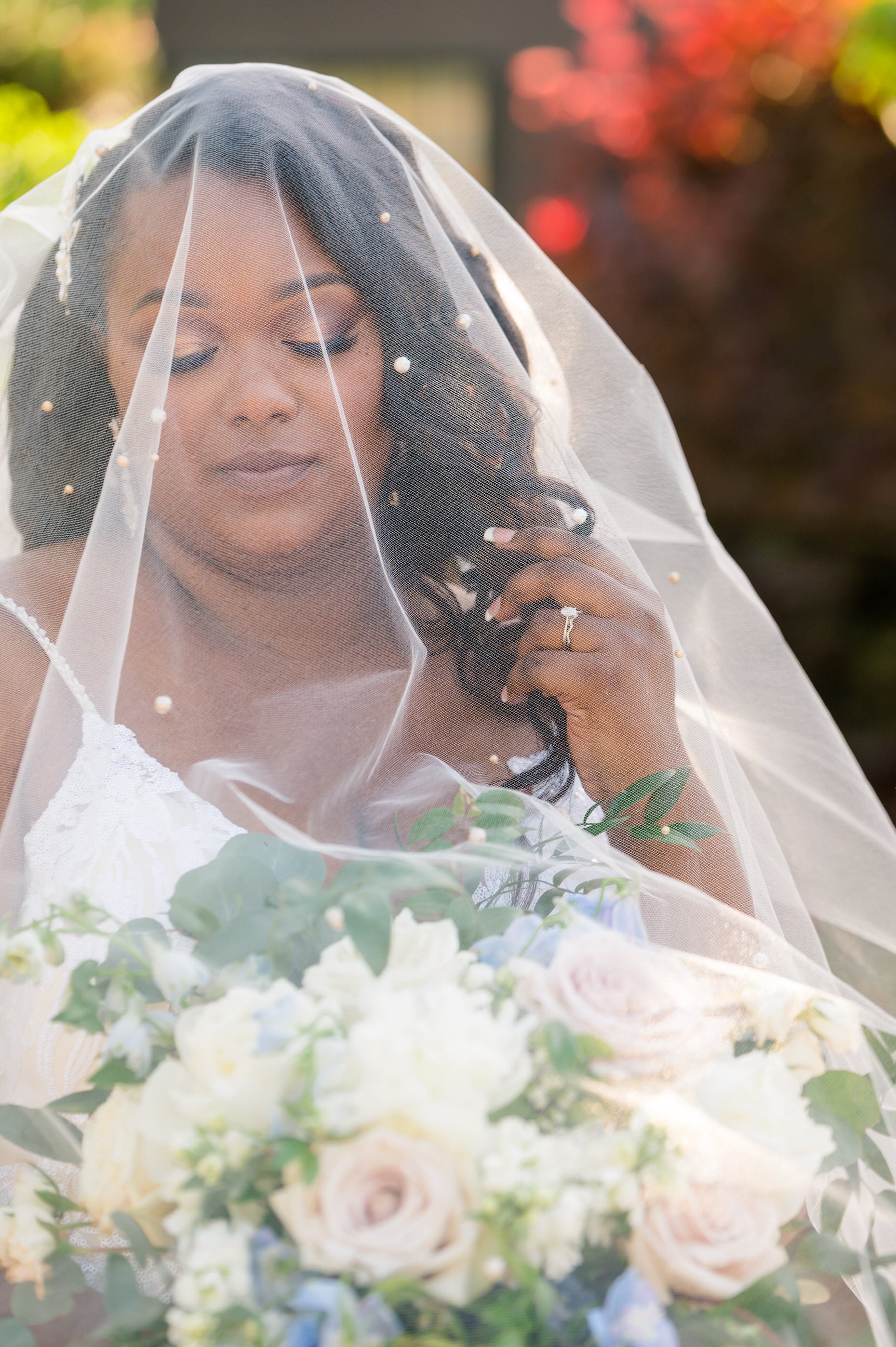 drop wedding veil with pearls in downdo hairstyle