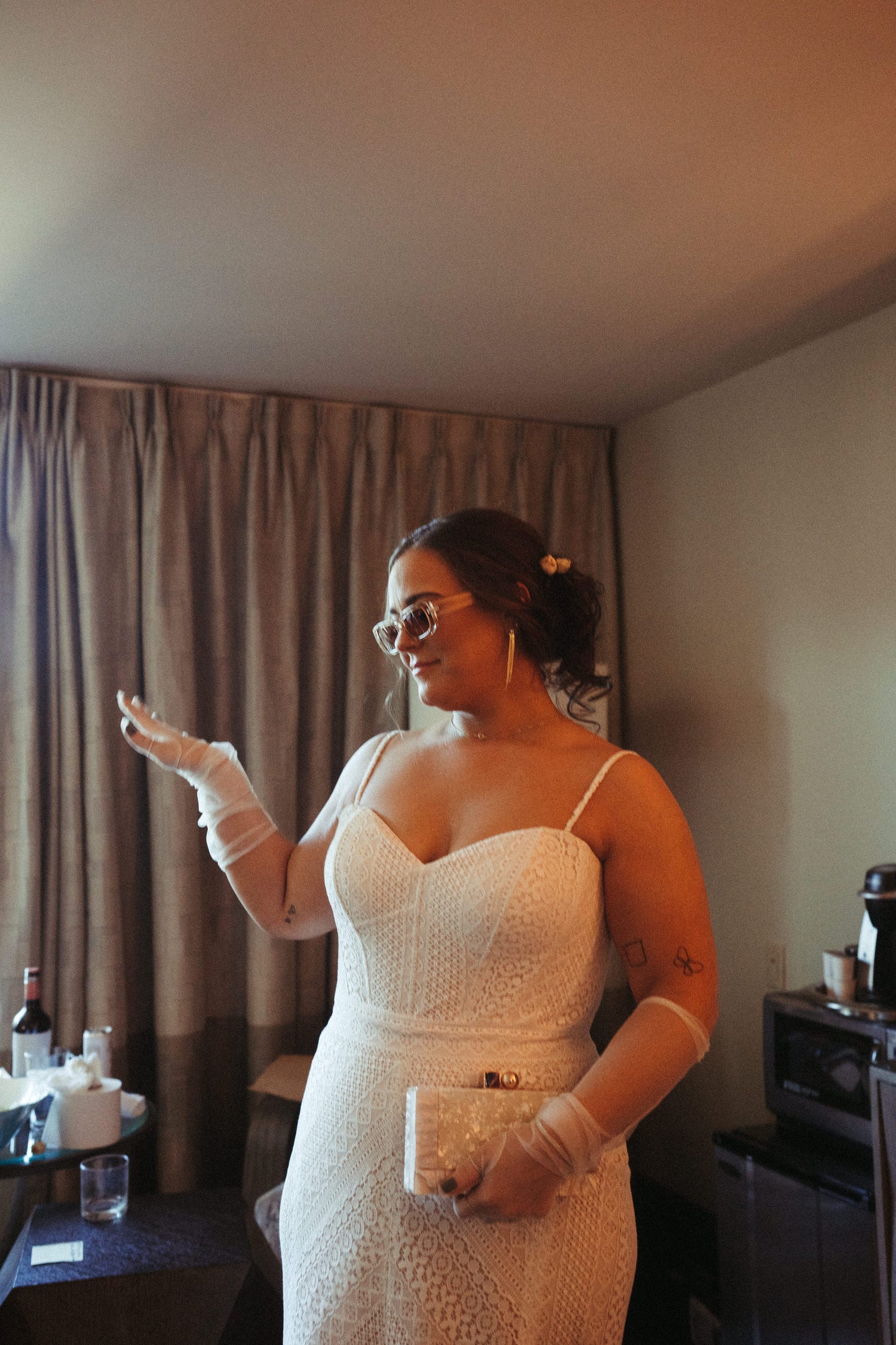 glamorous long bridal glove set in ivory on bride wearing sunglasss