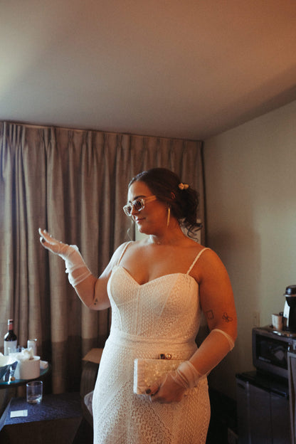 glamorous long bridal glove set in ivory on bride wearing sunglasss