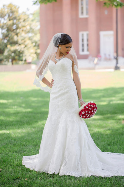 lace mid length veil with lace gown and red roses
