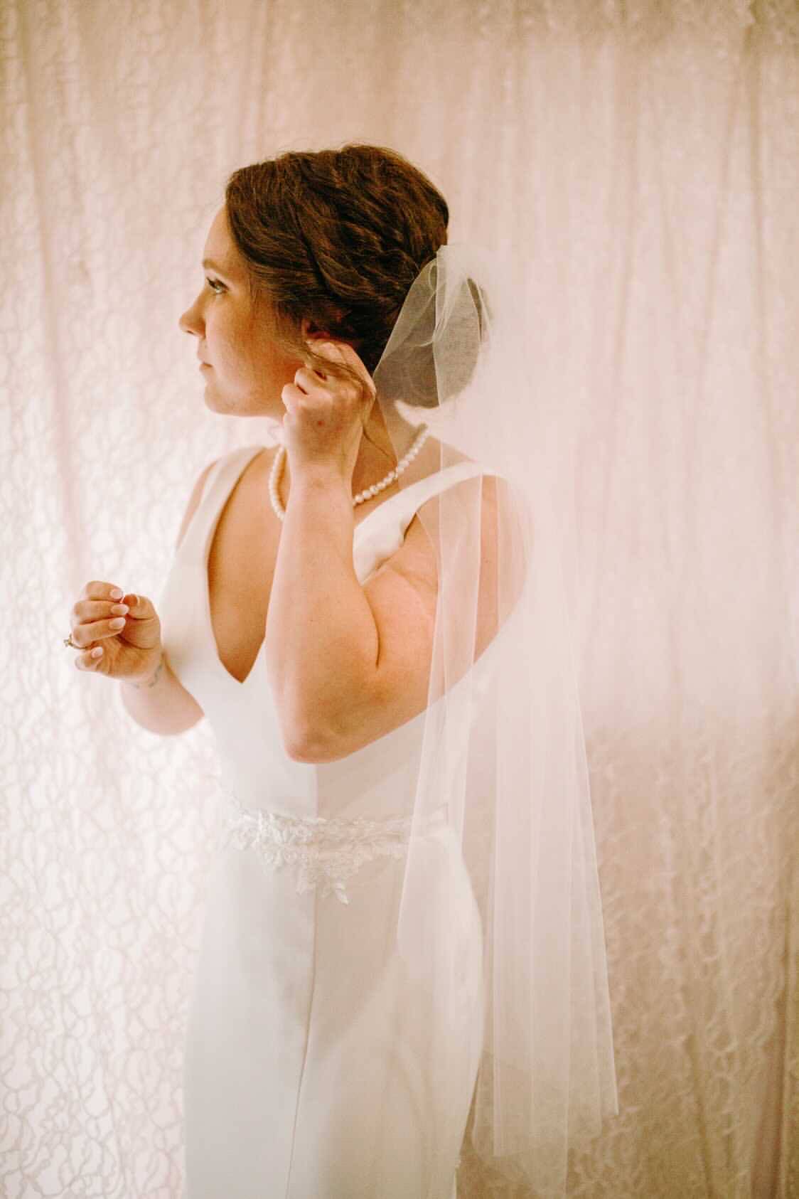 simple minimalist raw edge wedding veil with V necked dress