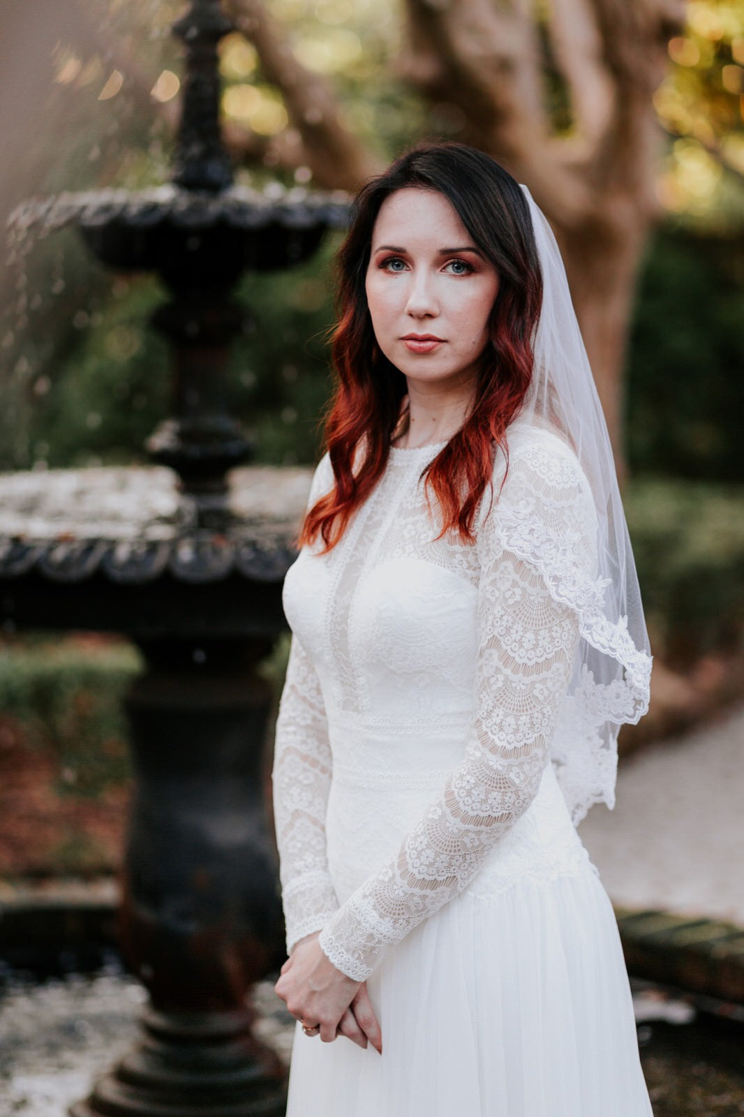 moody wedding inspiration with bride in elbow length bridal veil with french lace trim