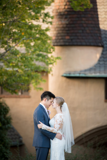 timeless wedding with bride in sheer fingertip length veil over bun